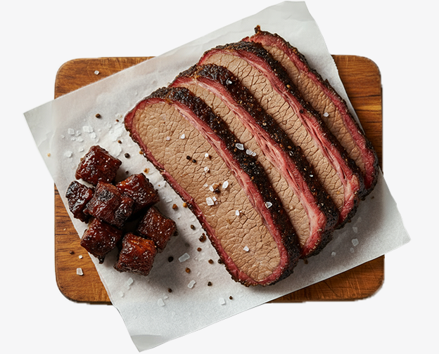 Sliced brisket and burnt ends on butcher paper